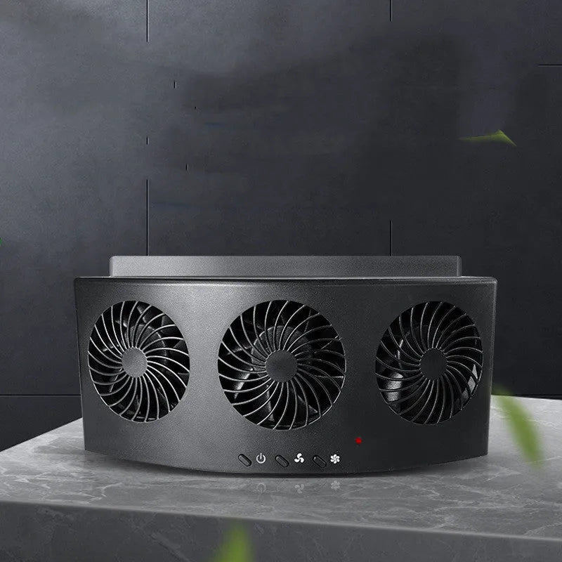 Black and white portable USB car ventilation fan on a car dashboard with power cable.