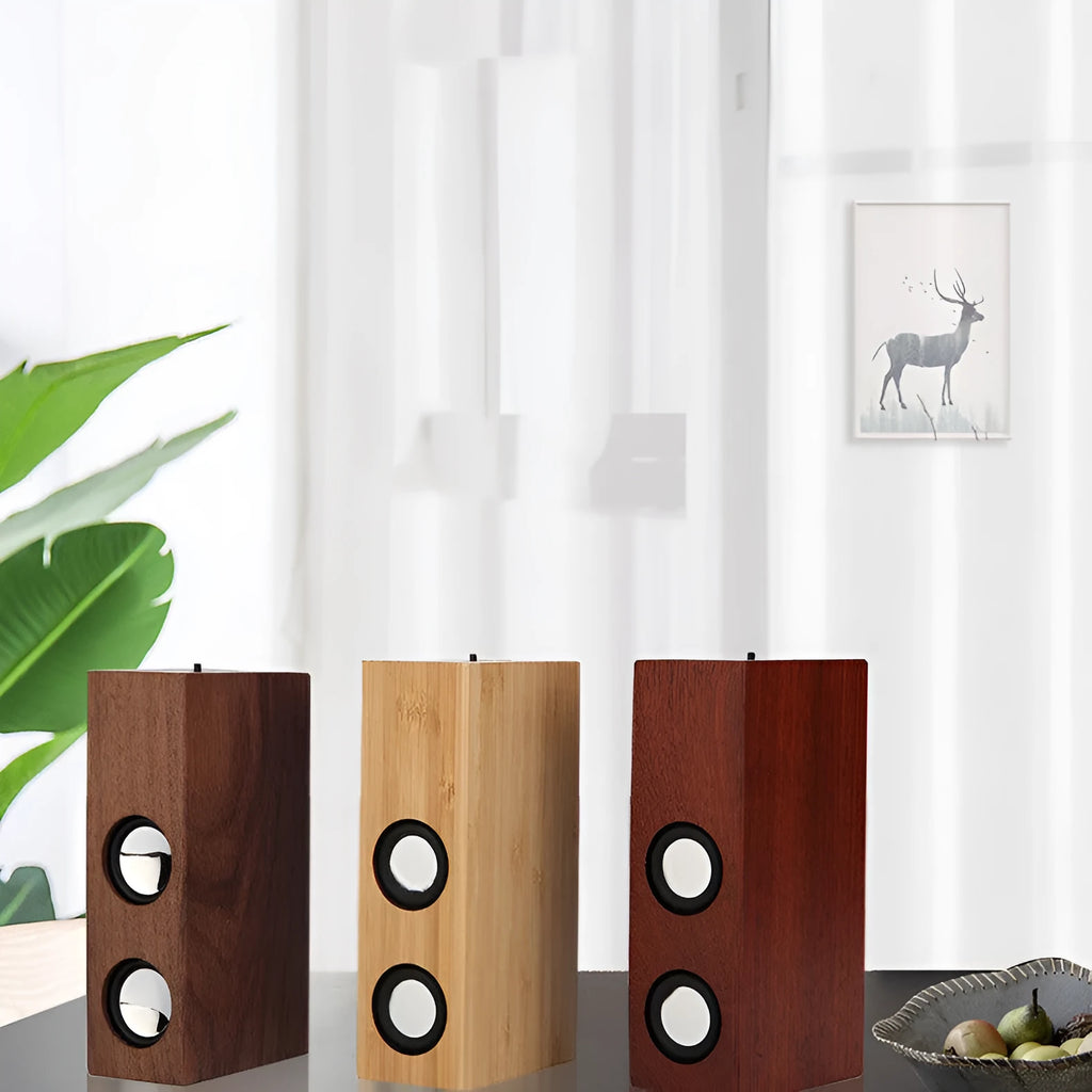 Wooden Bluetooth speaker in bamboo, black walnut, or sapele finish with 7-hour battery.