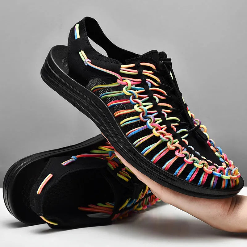 Woven Roman-style sandals with an elastic drawstring tie and non-slip rubber sole in rainbow colour.