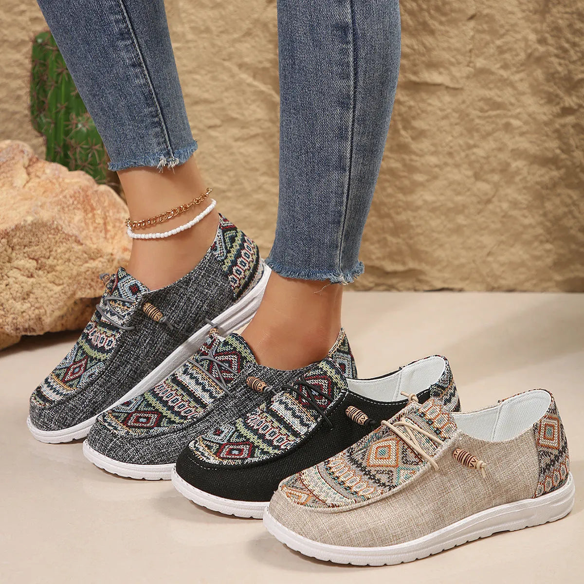 Women's low-top flat slip-on shoes in black with a round toe and rubber sole.