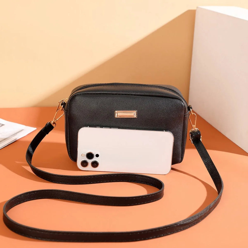 Women's PU shoulder bag in horizontal square shape with three-dimensional pocket, shown in solid colour options.