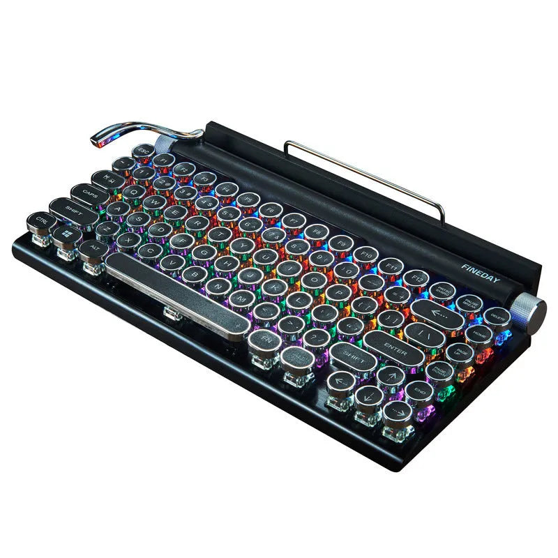 Black retro-style mechanical keyboard with typewriter keycaps and multi-colour backlighting on a desk.