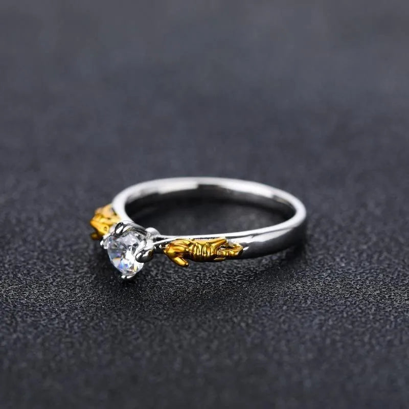 Copper crown fashion ring with black gold crystal centrepiece shown in individual packaging
