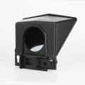 Portable small black cell phone teleprompter with adapter rings and remote control on a table