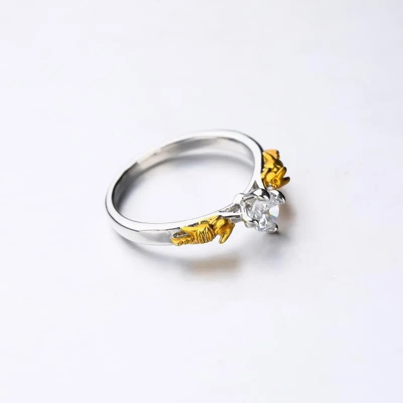 Copper crown fashion ring with black gold crystal centrepiece shown in individual packaging