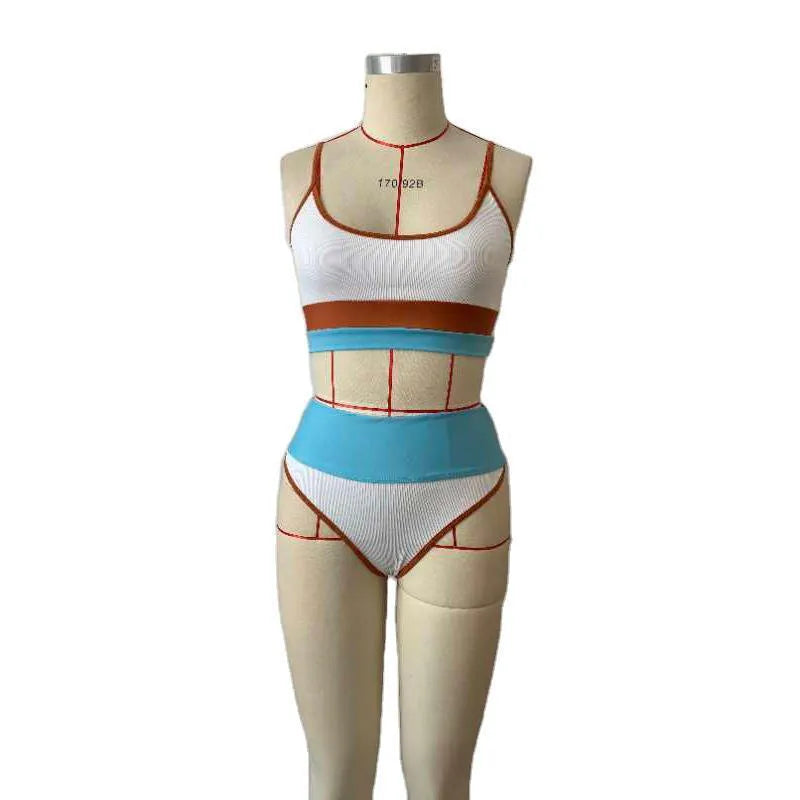 Women's solid colour quick-dry swimwear set consisting of a top and shorts.