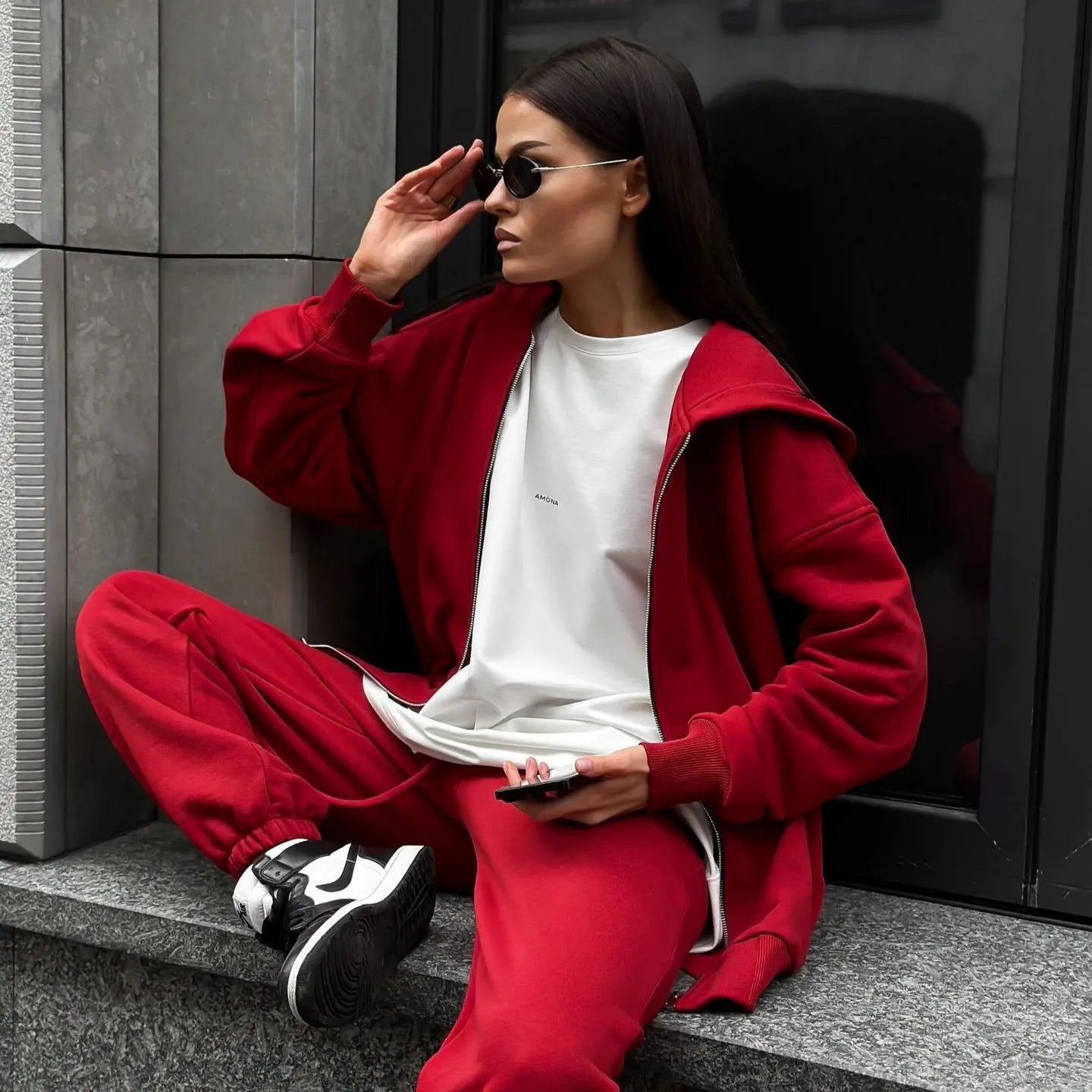Women's loose fit polyester two-piece set with long-sleeved coat and trousers in a solid colour.