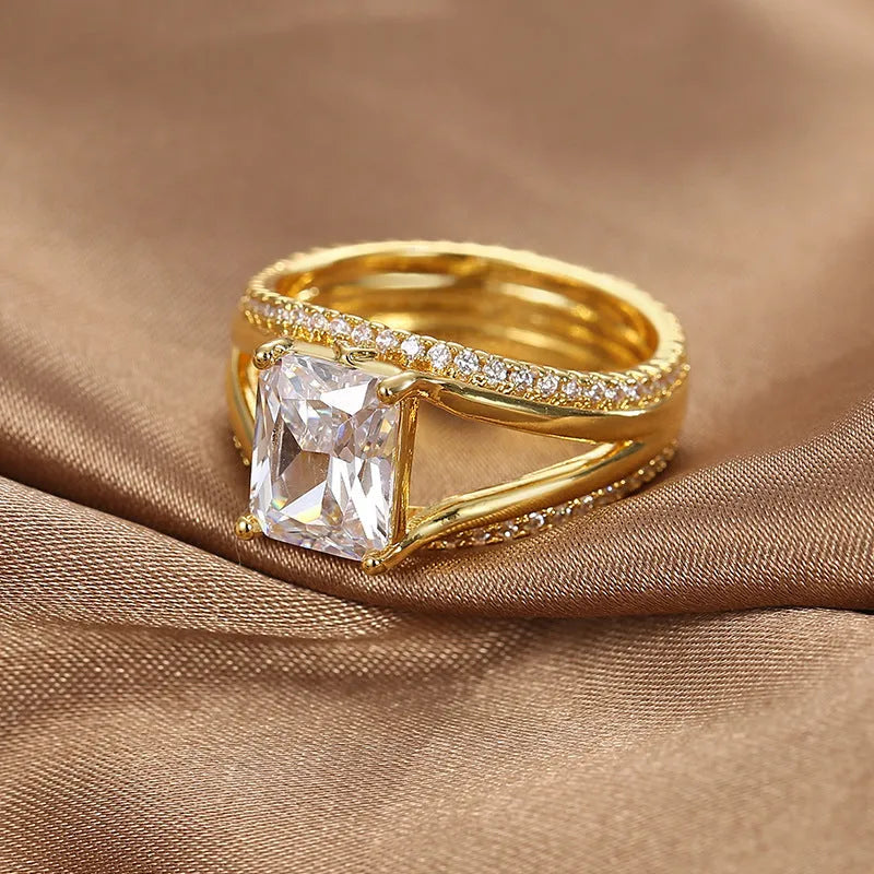 Gold geometric women's ring with zircon stones showing side and top view