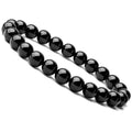 Women's black onyx bead bracelet with geometric design on a stretchy elastic cord.