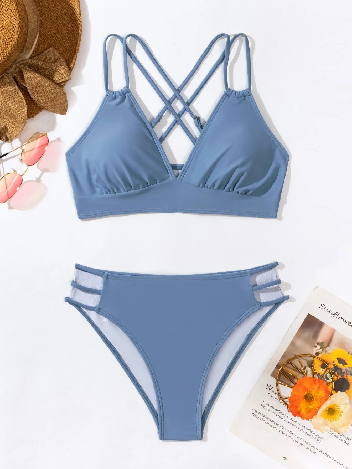 Women's black halter V-neck bikini top and matching split-style swim shorts.