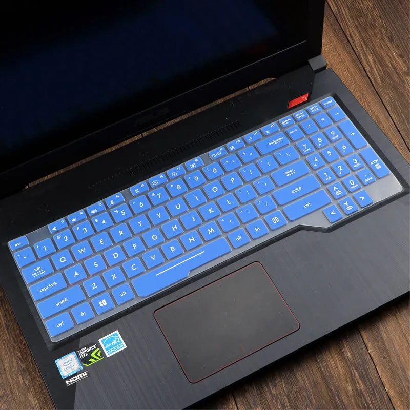 ASUS VivoBook 15 X513 laptop with a translucent mint coloured silicone keyboard protector fitted.