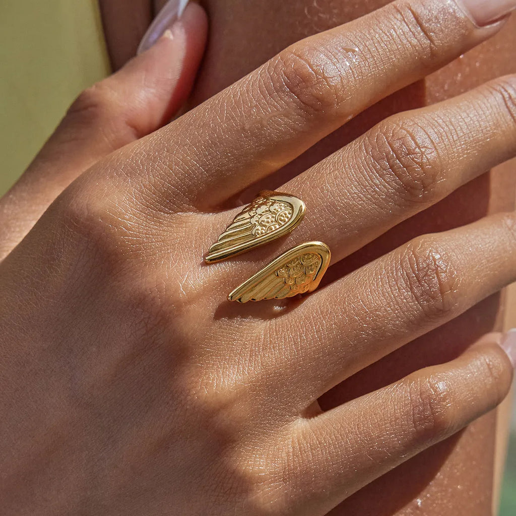 Stainless steel adjustable wings ring with electroplated colour finish and opening ornament design