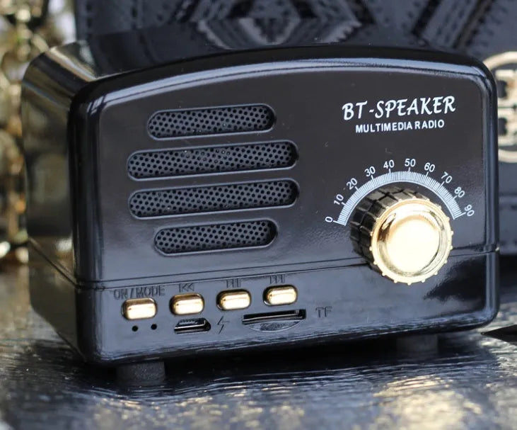 Compact vintage wood finish Bluetooth speaker in black, pink, or wood grain colour