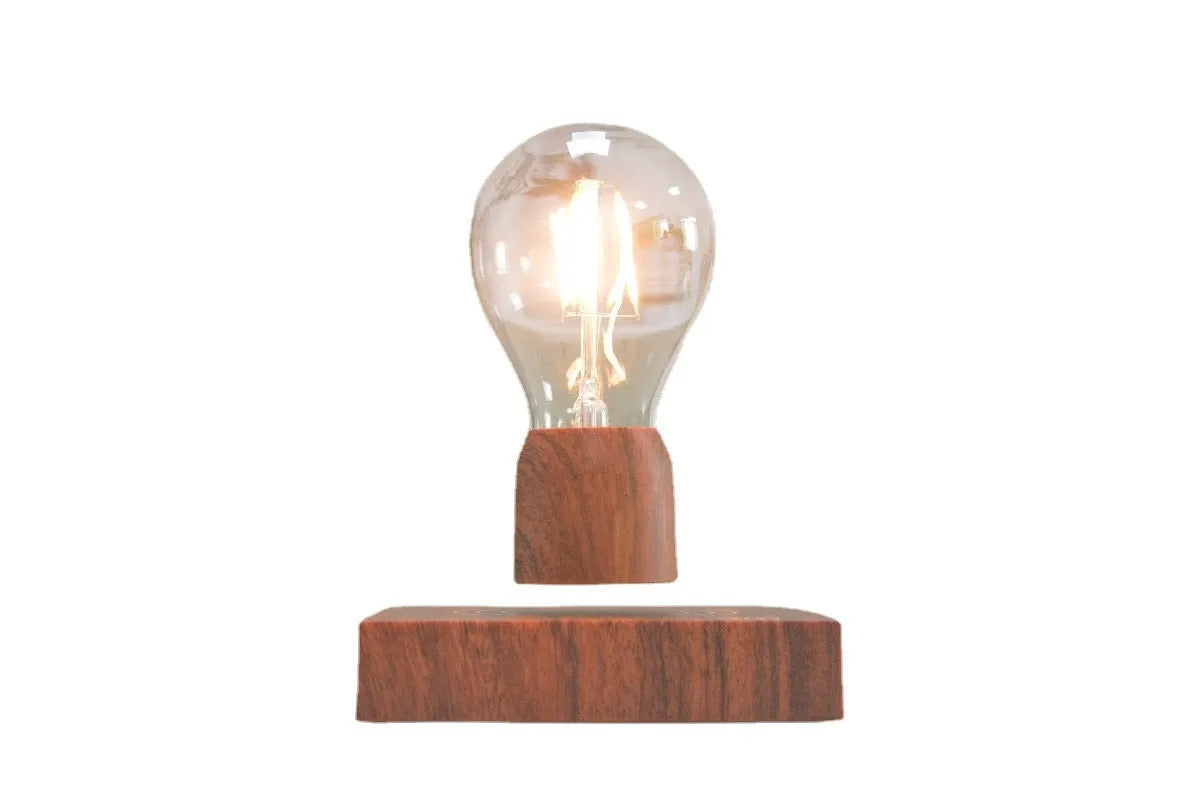 Glass and ABS magnetic levitation bulb floating above an imitation wood base.