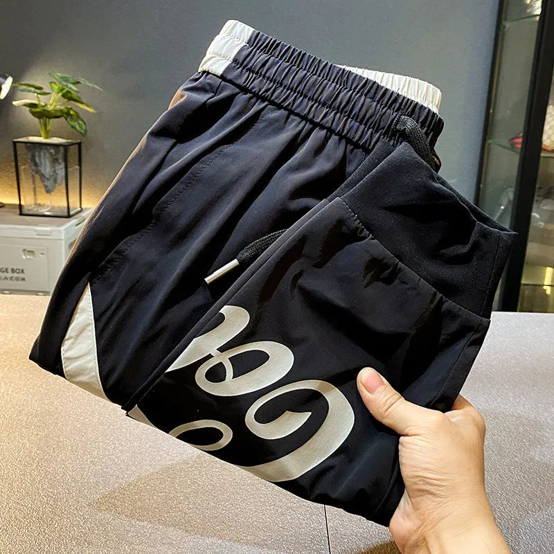 Black men's casual cropped trousers with an ankle band, made from ultra-thin ice silk cotton fabric.