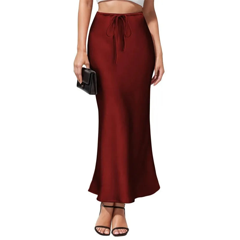 Women's high waist asymmetric acetate skirt with irregular stitching detail in black.