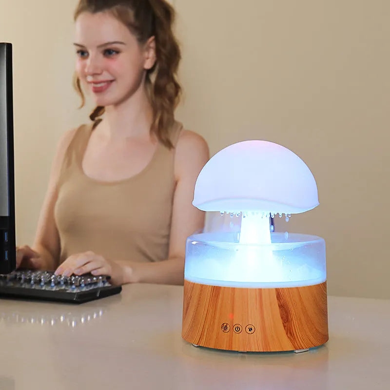 White rain cloud shaped humidifier and aroma diffuser with LED lighting and rainfall simulation