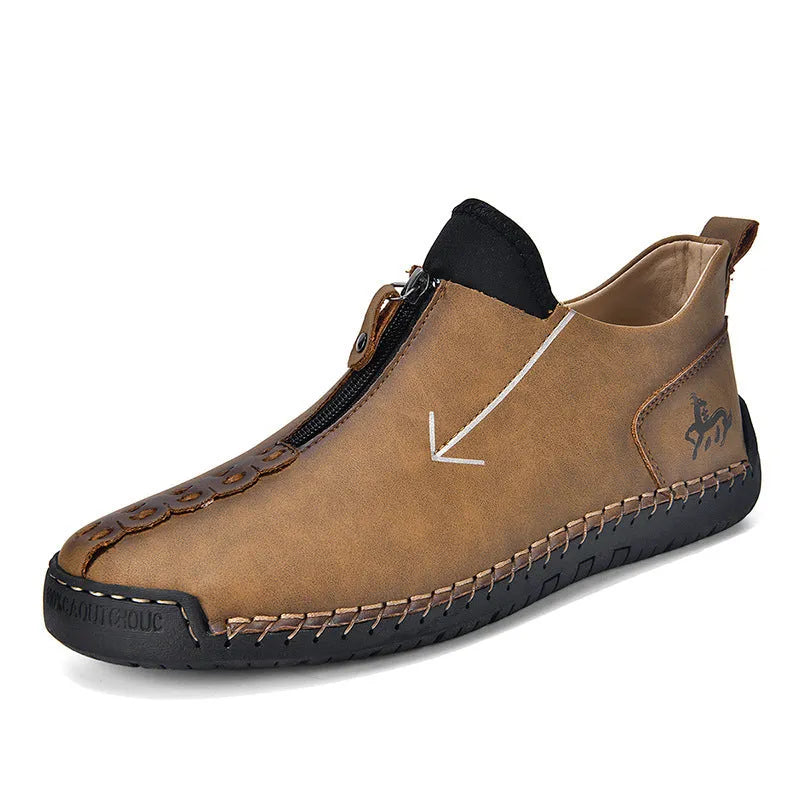 Men's black leather zip-up Martin boots with hand-stitched detail and a round toe.