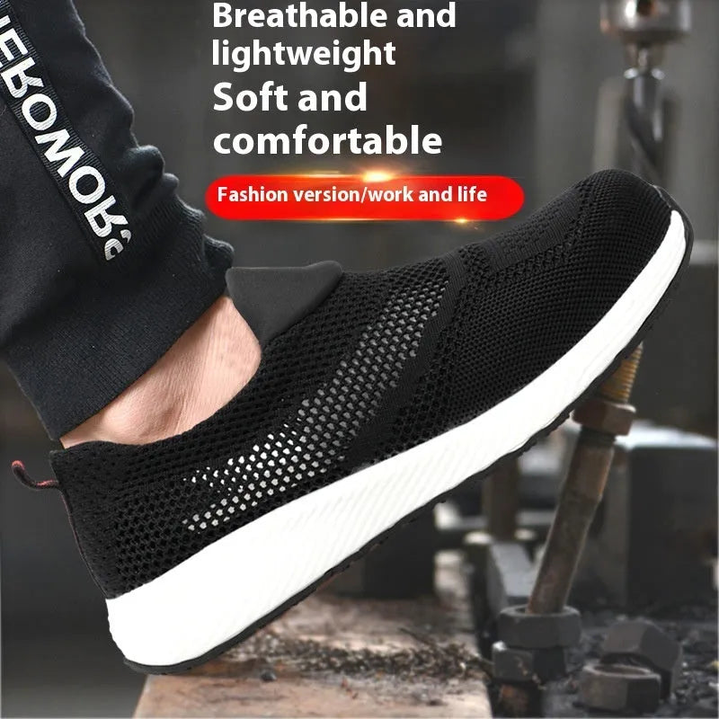 Men's lightweight black steel toe safety work shoes with mesh upper on a work floor