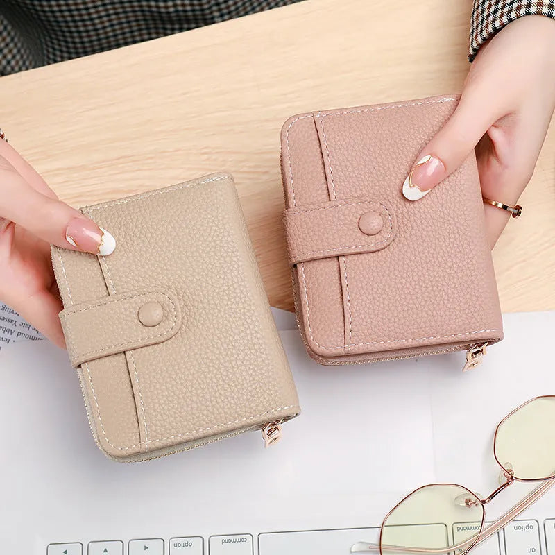 Ladies fold wallet with lychee pattern in PU leather showing beige, pink, black and red colour options