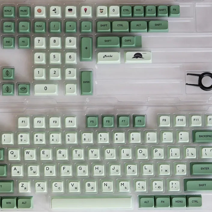 Full set of 124 matcha green PBT keycaps for a mechanical keyboard, showing various international layout options.
