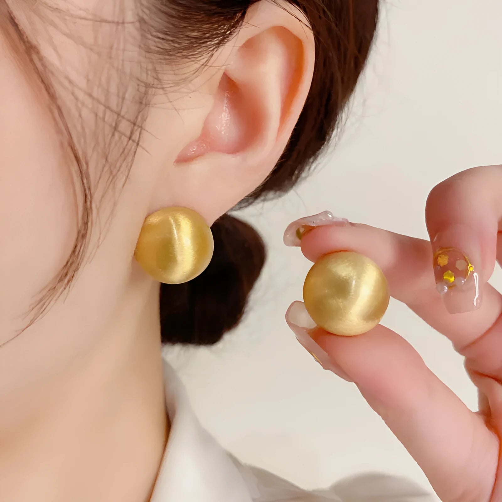 Simple round copper earrings in gold colour with electroplated finish