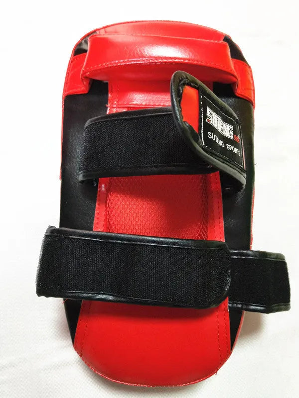 Black and red handheld boxing Sanda foot target with double buckle strap on the back.