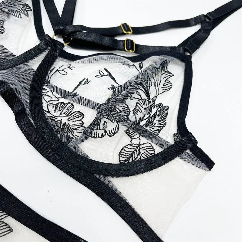 Black lace mesh women's three-piece set with floral print, showing top, trousers, and waist ring.