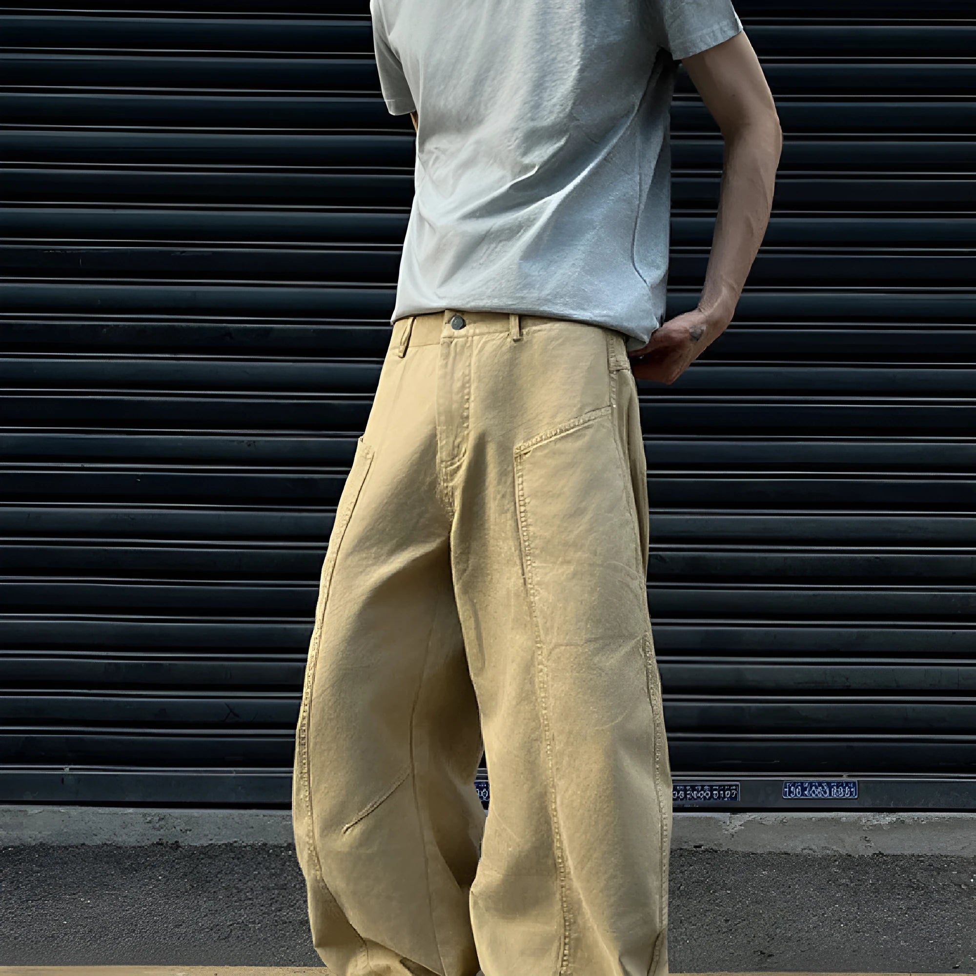 Men's khaki straight-leg cotton trousers laid flat, showing casual American retro style.