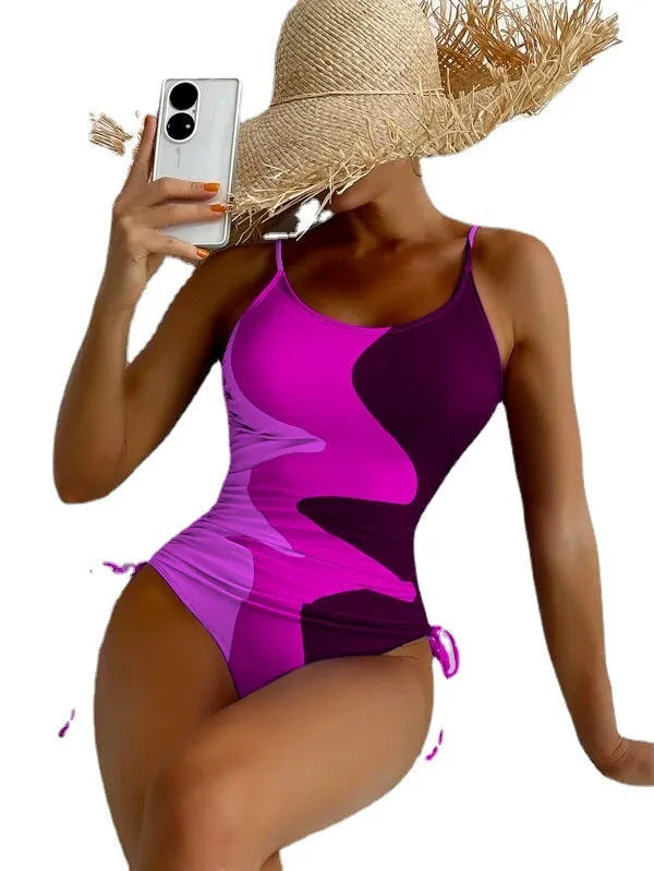 Women's sleeveless one-piece swimsuit in blue, purple, brown, or green colours with striped or solid patterns