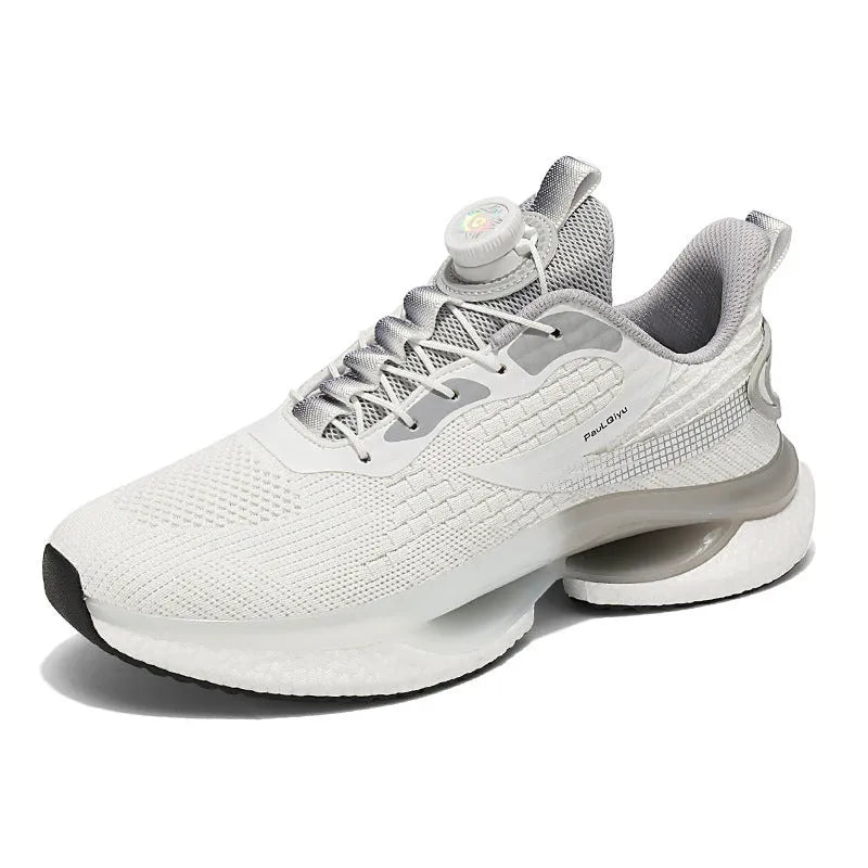 Men's white low-top running shoes with a rotating button buckle and round toe on a gray background.