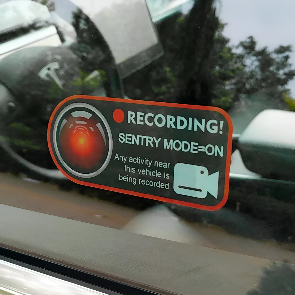 A pair of white and red electrostatic warning stickers for Tesla car windows measuring 11 by 5 cm.