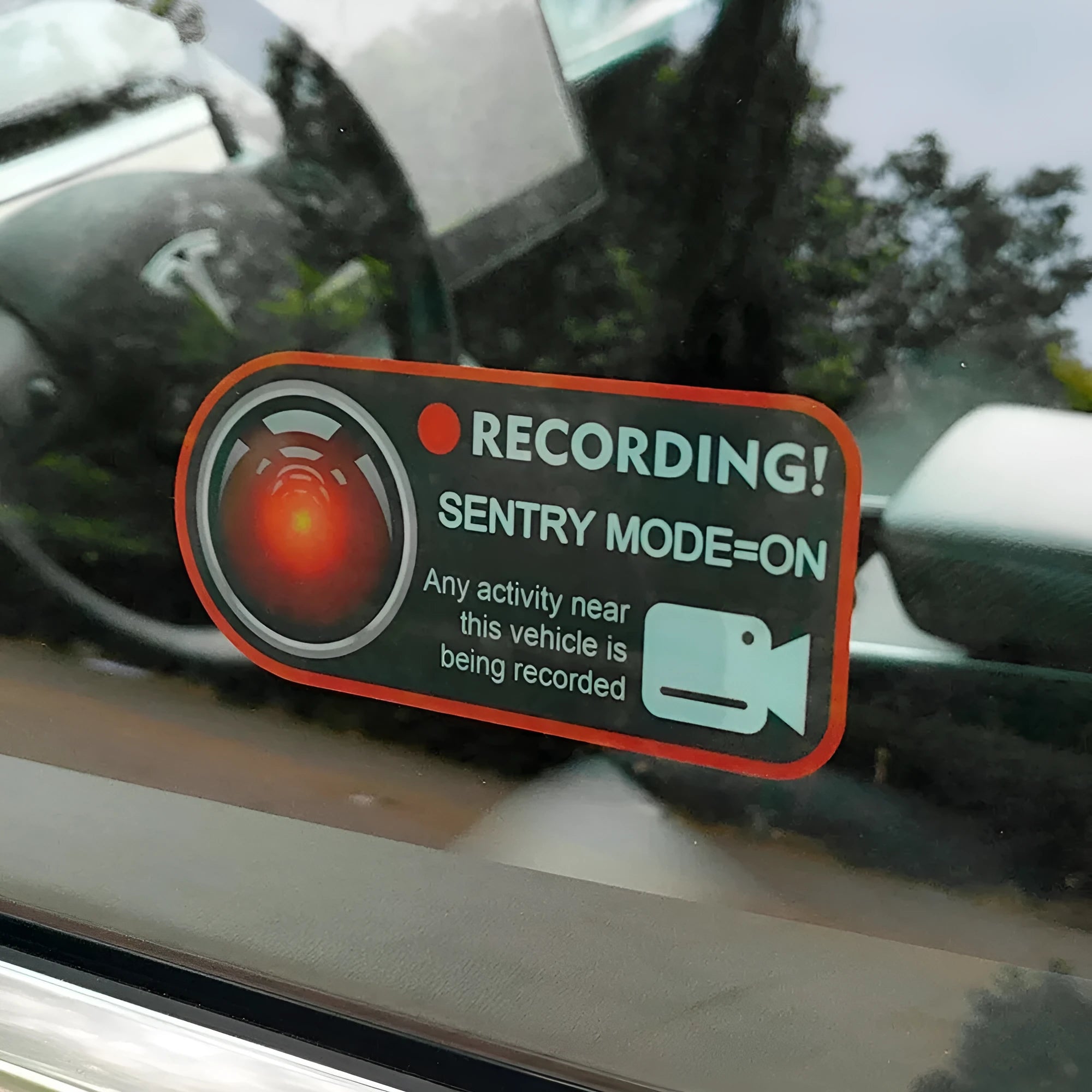 A pair of white and red electrostatic warning stickers for Tesla car windows measuring 11 by 5 cm.