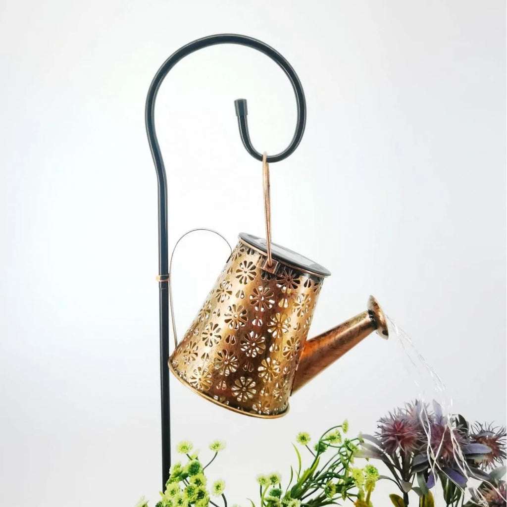 Solar-powered wrought iron butterfly kettle light for outdoor garden decoration.