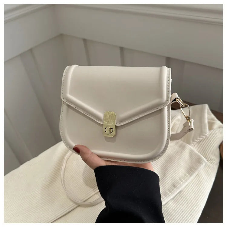 Soft PU leather messenger bag with clamshell opening in a horizontal square shape.