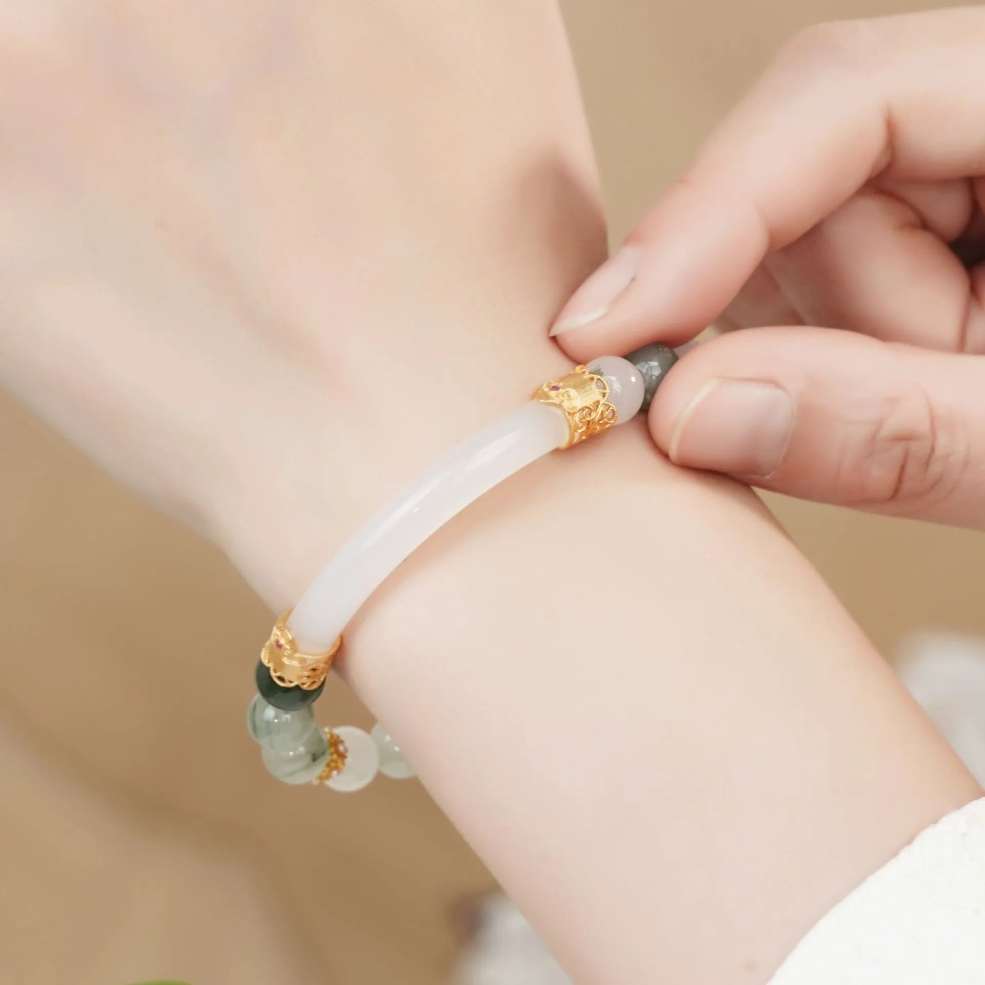 Emerald green Tian Shan Cui stone women's bracelet with floating floral motif and circular pattern