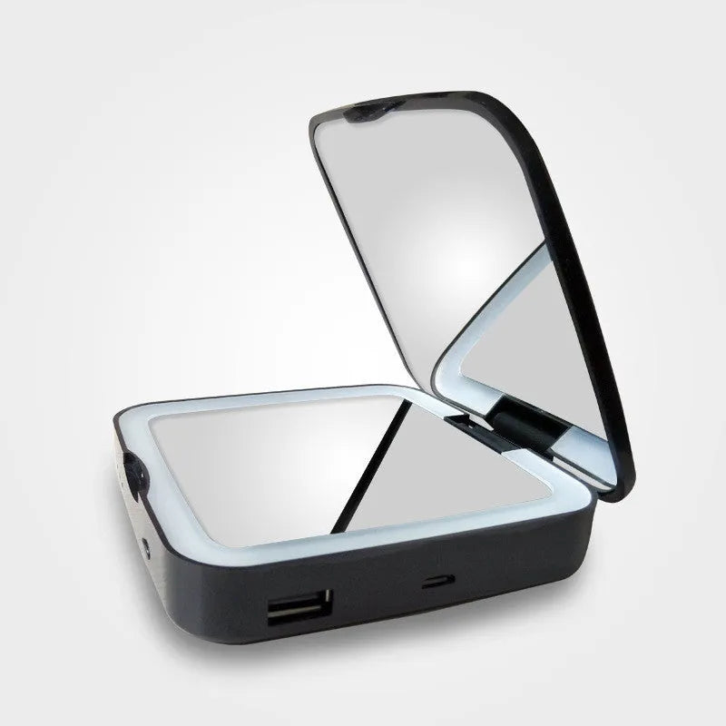 Black and white LED makeup mirror showing standard and 4x magnification sides with adjustable lighting.