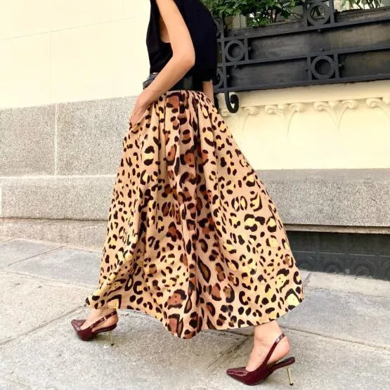 Brown leopard print women's long A-line skirt on a hanger.
