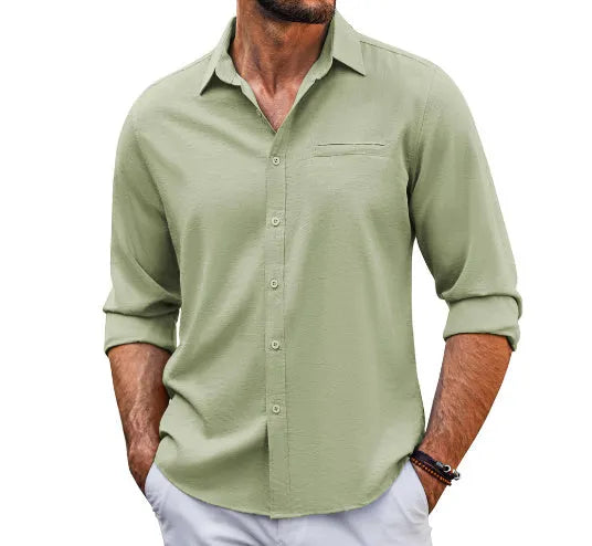 Man wearing a grey casual long sleeve cotton blend shirt with a polo collar and chest pocket.