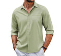 Man wearing a grey casual long sleeve cotton blend shirt with a polo collar and chest pocket.