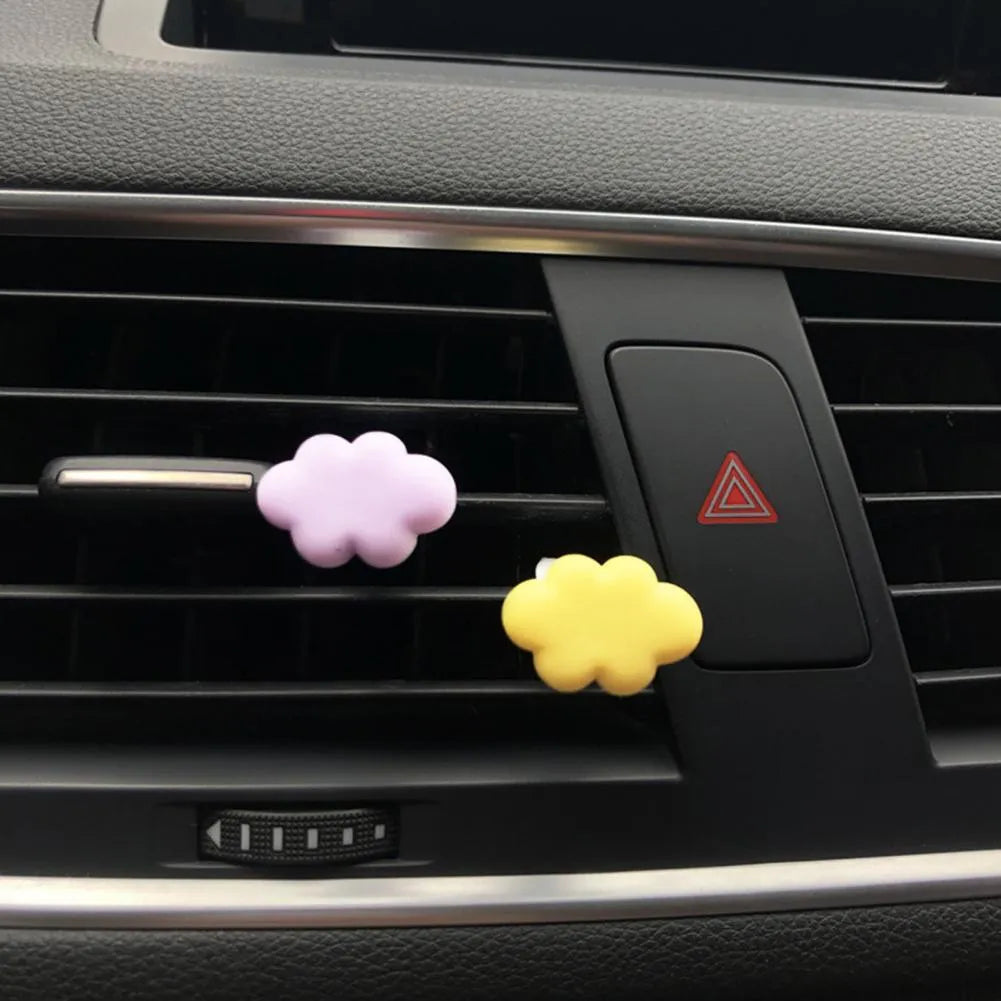 Resin Baiyun cloud cartoon car air freshener clip in pastel colours for vehicle vents.