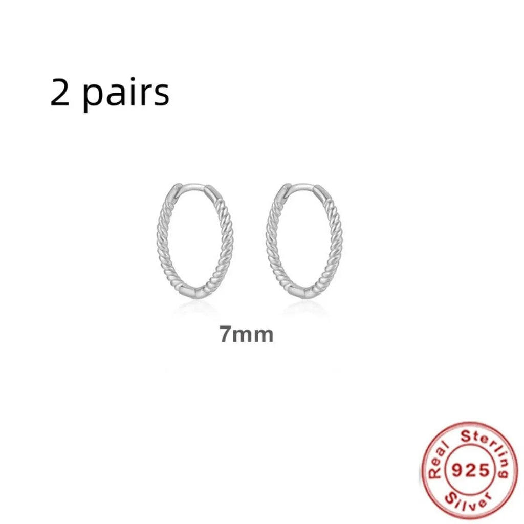 Twisted sterling silver round ring earrings in golden and white gold finishes