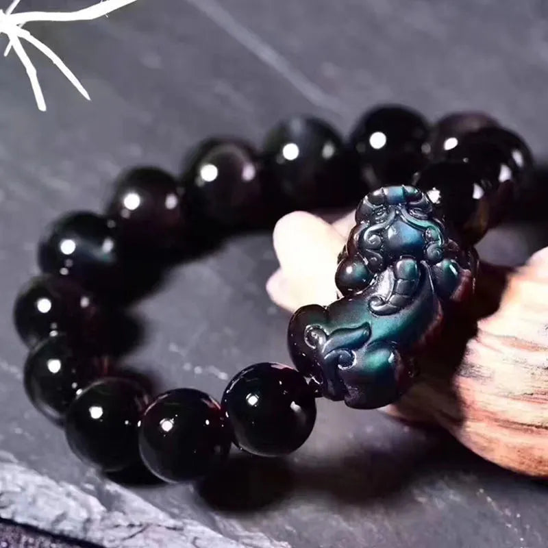 Natural ice colour eye obsidian crystal bracelet showing marbled patterning on beads