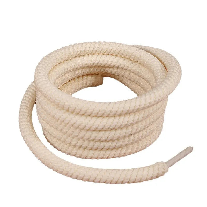 Round white woven shoelace on a grey background showing its 10mm diameter and textured weave.