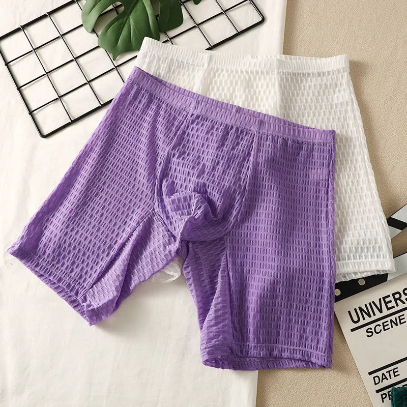 Men's solid colour lace boxer shorts with a lengthened hip-lifting design for shaping.