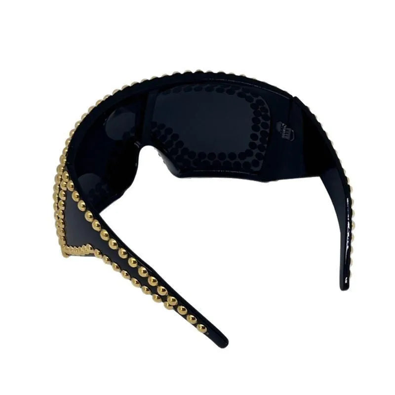 Men's square aviator sunglasses with large rim and rivet details in gold colour.