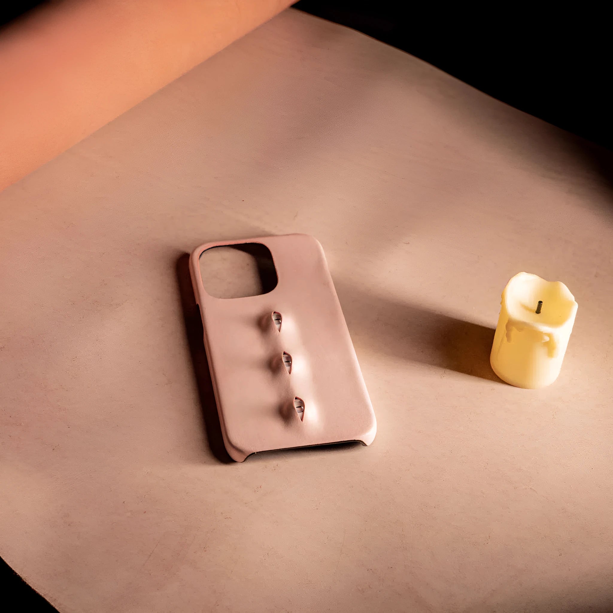 Handmade waxed cowhide leather eye phone case in pink with three-eye vertical design