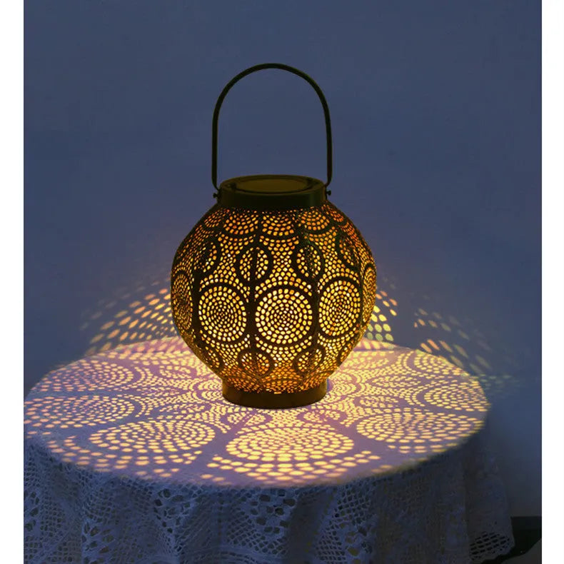 Solar-powered decorative iron courtyard lamp with hollow design for outdoor garden use