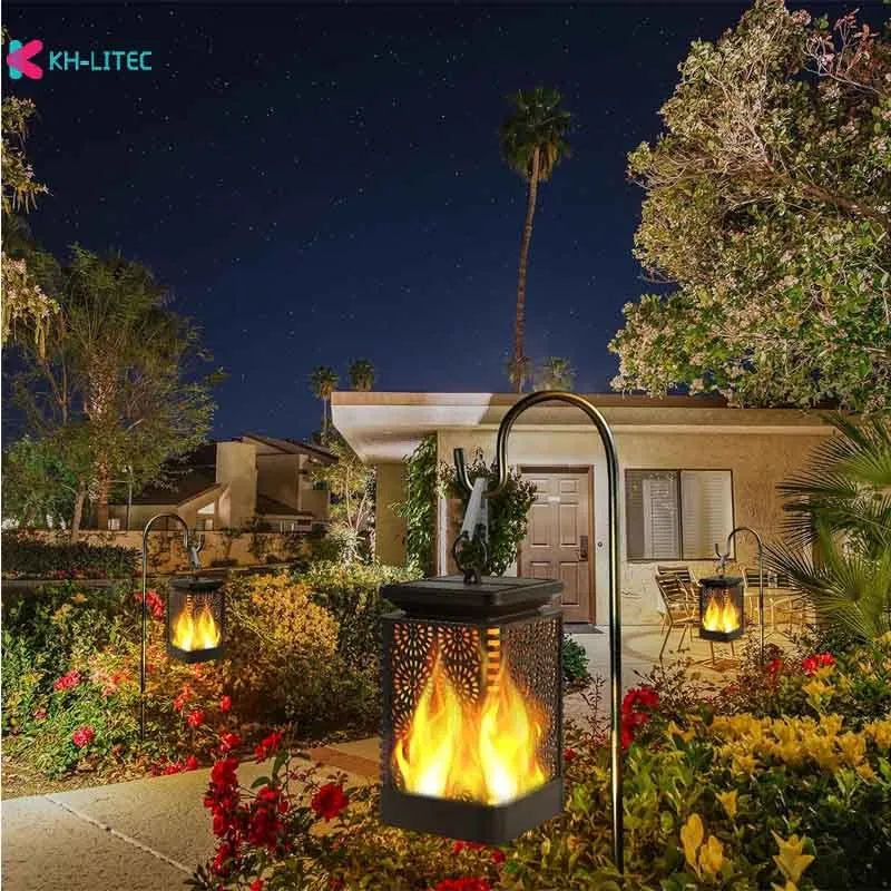 Four black solar-powered flame torch lights with flickering LED effect for garden decoration