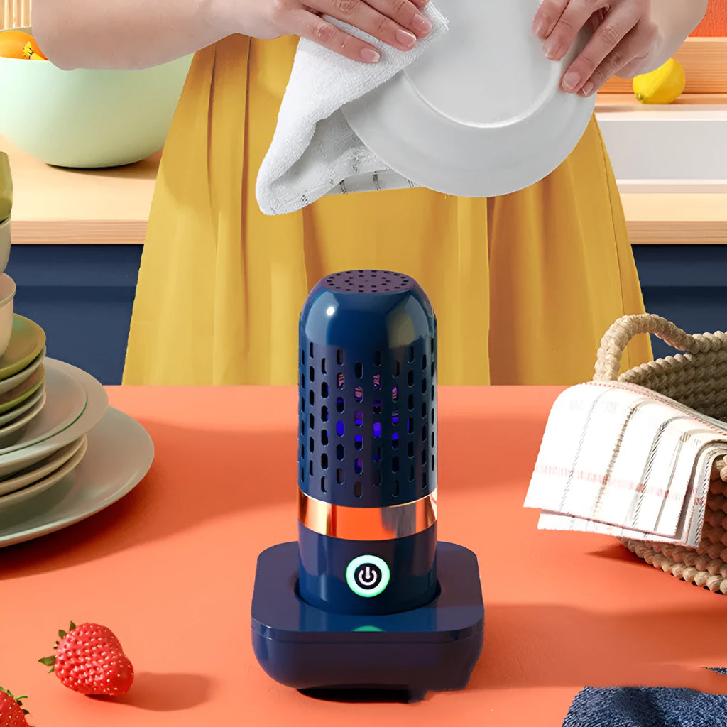 Blue capsule fruit and vegetable cleaner on a kitchen surface with USB charger